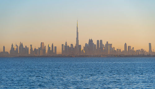 View of modern buildings against sky during sunset