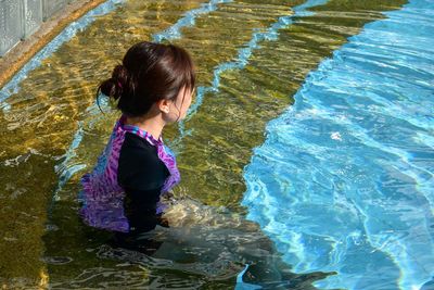 High angle view of woman in swimming pool