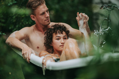 Portrait of a young man in swimming pool