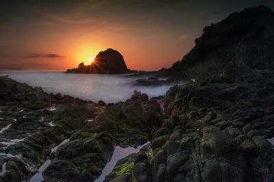 Scenic view of sea at sunset