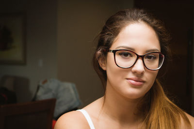 Close-up portrait of beautiful woman at home