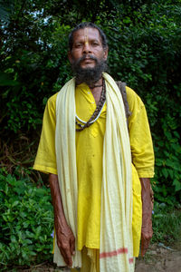 Portrait of a smiling young man standing outdoors