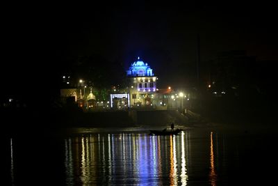 Reflection of illuminated buildings in water