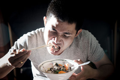 Portrait of man eating food