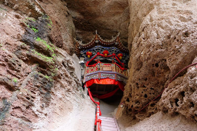 Low angle view of red rock in cave