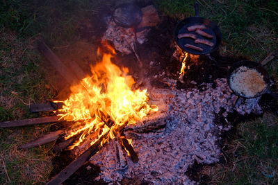 High angle view of bonfire on barbecue grill