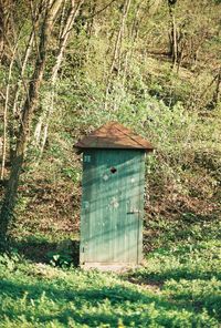 Built structure on field in forest