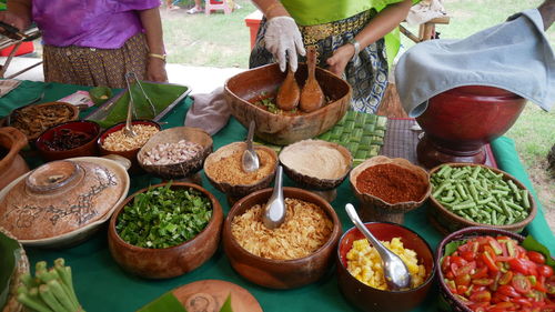 High angle view of people for sale at market stall