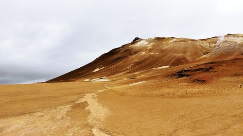 Scenic view of desert against sky