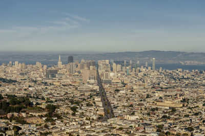 High angle view of city buildings against sky