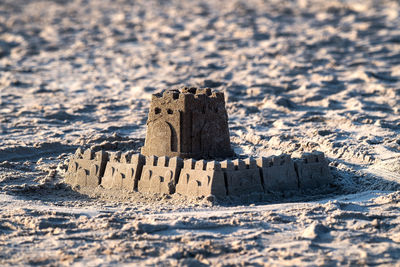 High angle view of text on sand