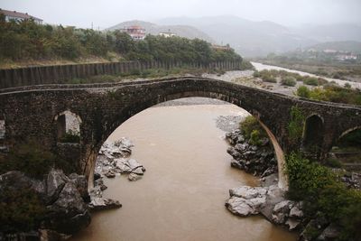 Arch bridge over river in albania