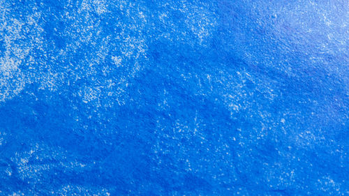 Full frame shot of frozen blue water
