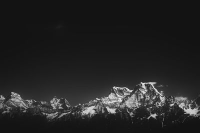 Scenic view of snowcapped mountains against sky during winter