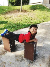 Portrait of smiling boy in yard