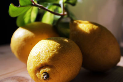 Close-up of lemons on table