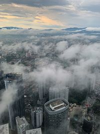 High angle view of buildings in city against sky