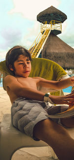 Portrait of a boy sitting on hammock