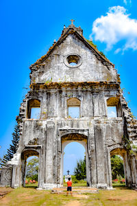 Rear view of old church building against sky