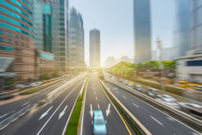 Blurred motion of vehicles on road in city