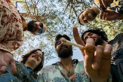 Portrait of friends enjoying in forest