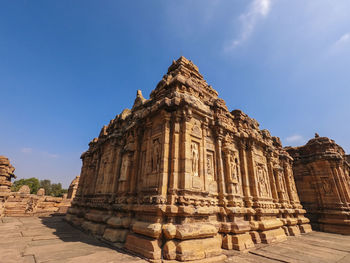 Old temple building against sky