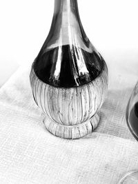 Close-up of glass bottle on table