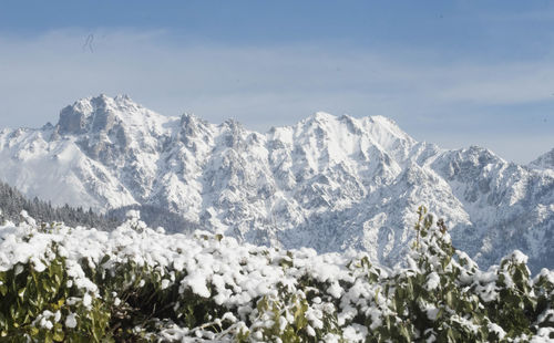 Scenic view of snowcapped mountains against sky