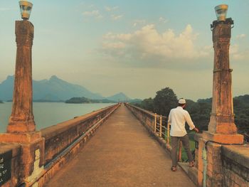 Tourist walking on sidewalk