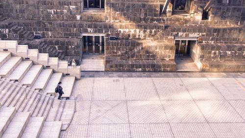 High angle view of man on staircase