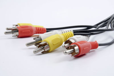 Close-up of cables over white background