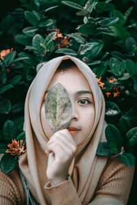 Portrait of young woman with eyes closed