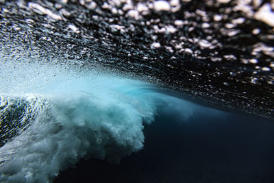 Underwater view of splashing sea wave