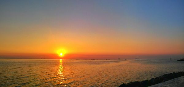 Scenic view of sea at sunset