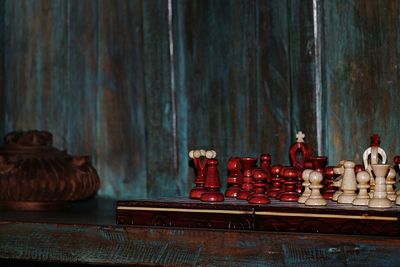 Chess pieces and board on table at home