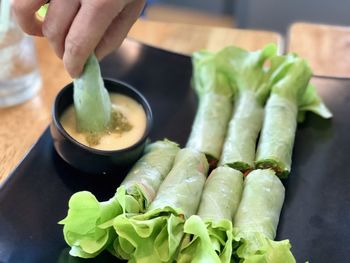 Close-up of hand holding vegetables