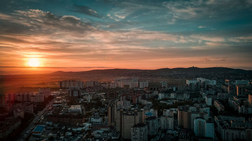 High angle view of buildings against sky during sunset