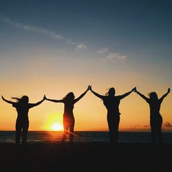 People enjoying at sunset