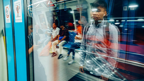 Reflection of people on glass window