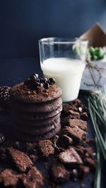 Cookies and glass of milk on table