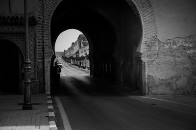 Road amidst buildings in city