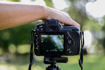 Close-up of hand holding camera