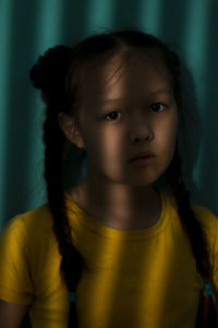 Portrait of a child with stripes of shadow on the face