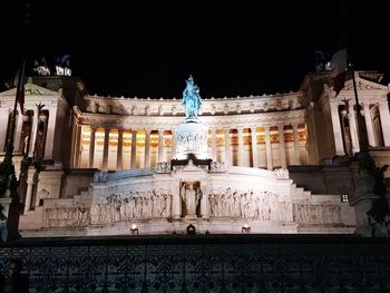 Low angle view of illuminated building at night