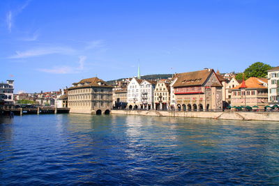 Buildings in zurich against blue sky