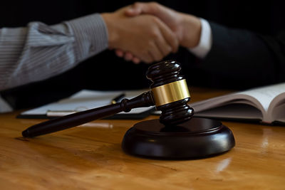 Close-up of hand holding table