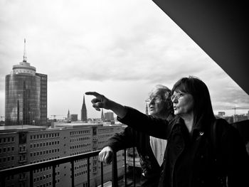 Woman looking at cityscape