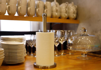 Stack of wine glasses on table