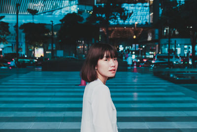 Portrait of young woman looking away