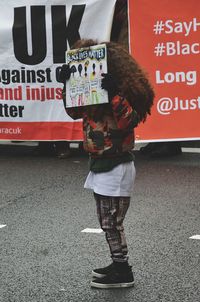 Low section of man standing on text